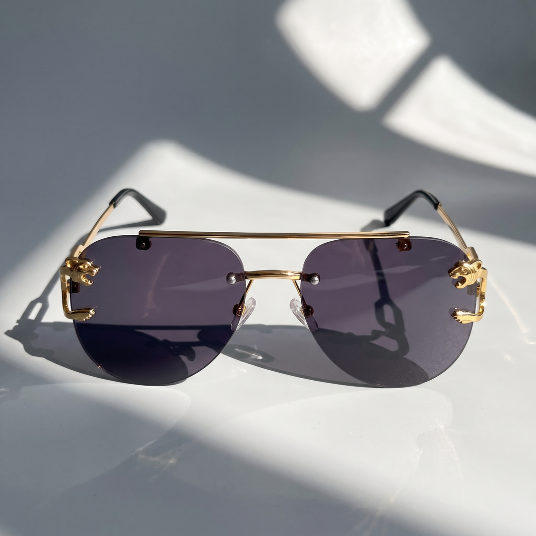 Retro semi-rimless women's sunglasses with tinted lenses. Offers chic UV eye protection and style.