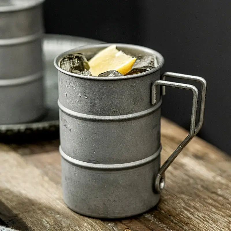 Vintage steel enamel mug, 13oz, for coffee/tea. Durable rustic drinkware, ideal for camping.