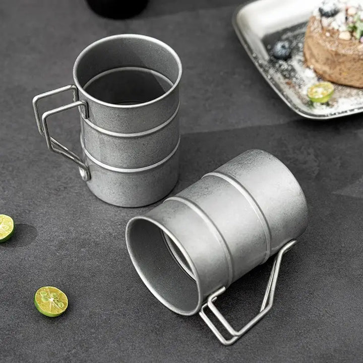 Vintage 13oz steel enamel mug, a durable coffee and tea cup. Ideal rustic kitchen essential and camping gear.