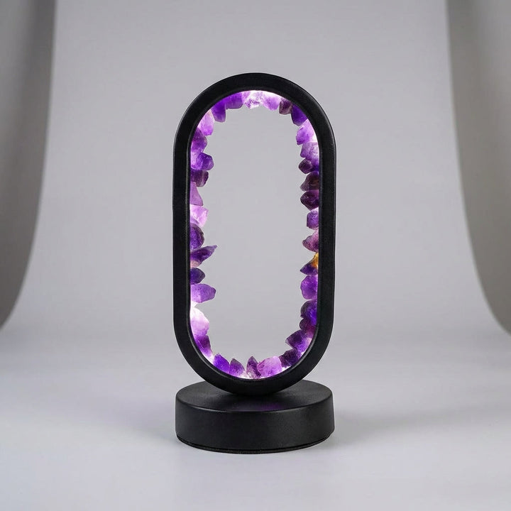 Decorative tabletop wellness lamp, Violetis, emitting a soft ambient light perfect for meditation.