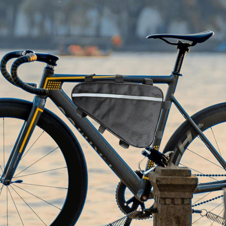 Waterproof Voltrix E-bike triangle battery bag, black, securely installed on a bike frame, side view