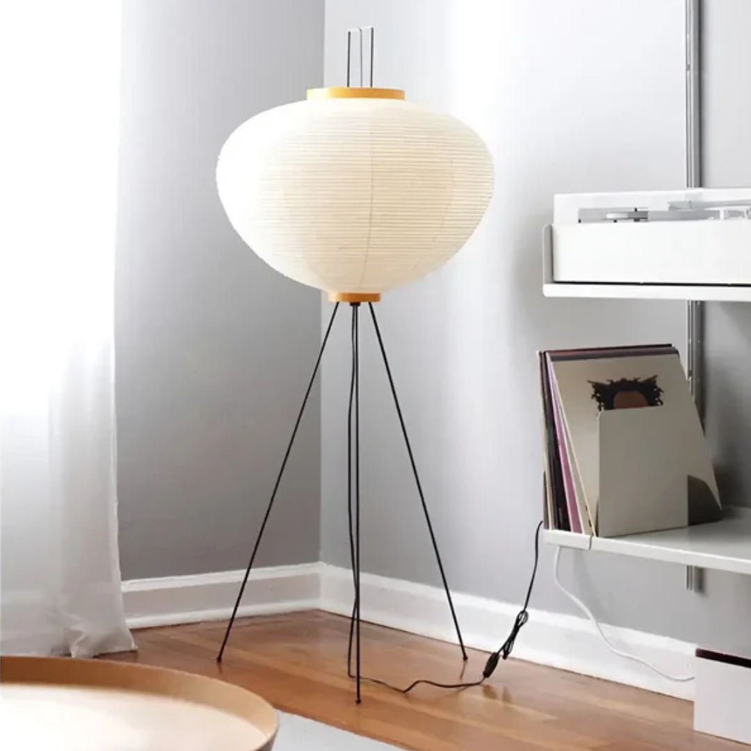 Wabi-Sabi rice paper standing LED floor lamp for tranquil ambient lighting in a living room. Modern zen home decor.