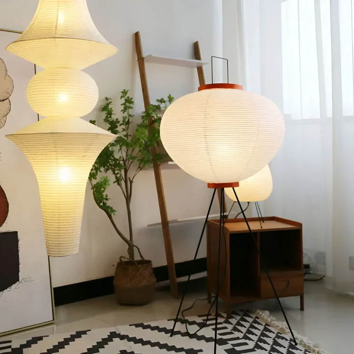 Illuminate your space with a Wabi-Sabi rice paper LED standing lamp, offering minimalist and tranquil ambient light.