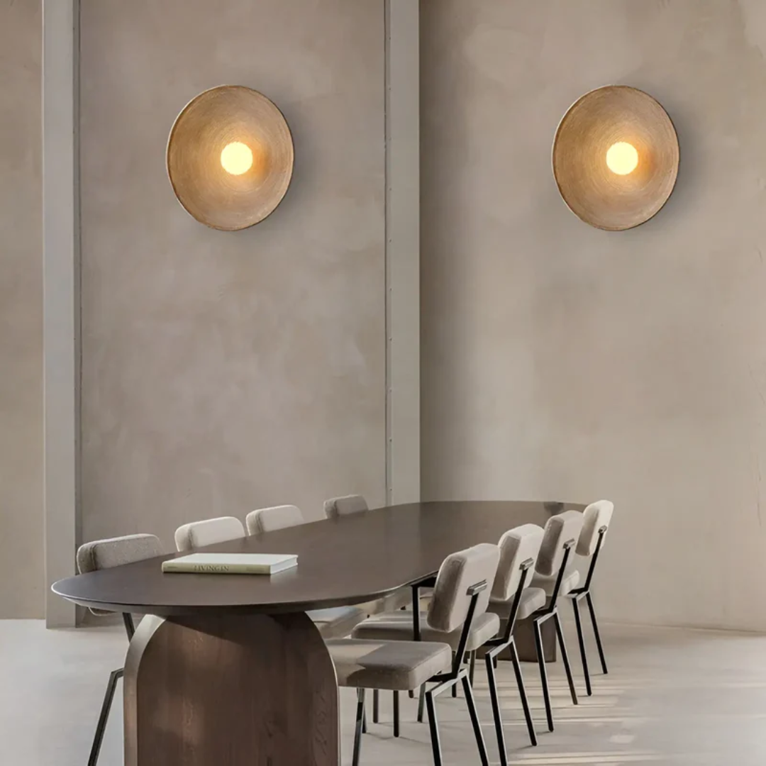 Close-up of a Wabi-Sabi modern disc wall lamp, showcasing its unique resin and glass texture.