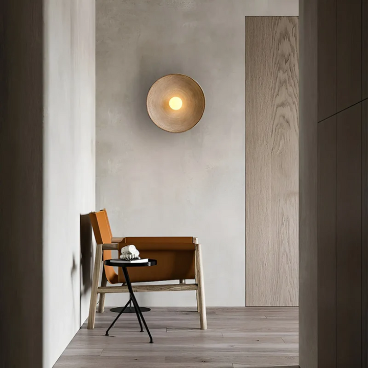 Ambient Wabi-Sabi disc wall lamp in a modern, minimalist living space, enhancing tranquil decor.