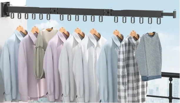 Retractable wall mounted drying rack for clothes, ideal for laundry room efficiency & space.