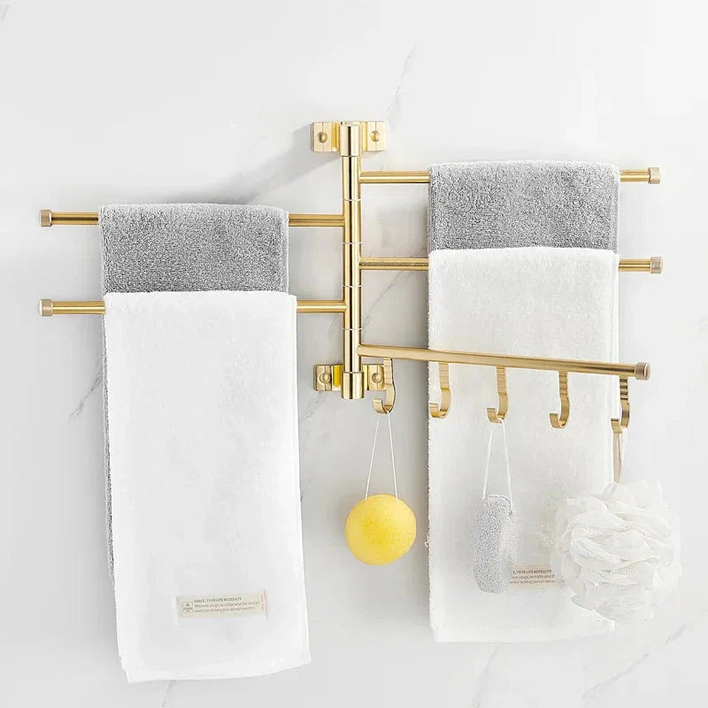 Bathroom wall decor: Gold finish triple arm towel rack, offering practical and chic towel storage.