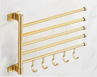 Sleek wall-mounted gold towel lattice, featuring three arms for bathroom essentials, enhancing home decor.