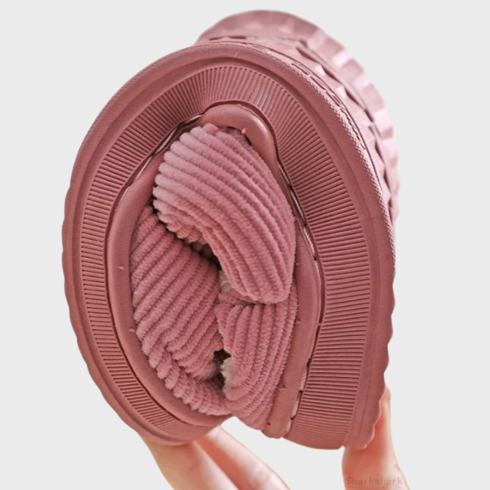Soft ribbed fabric women's slippers, ideal for warm, cozy winter loungewear.