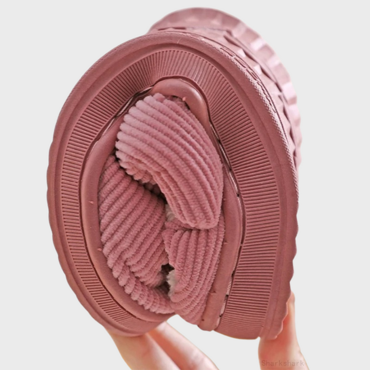 Soft ribbed fabric women's slippers, ideal for warm, cozy winter loungewear.