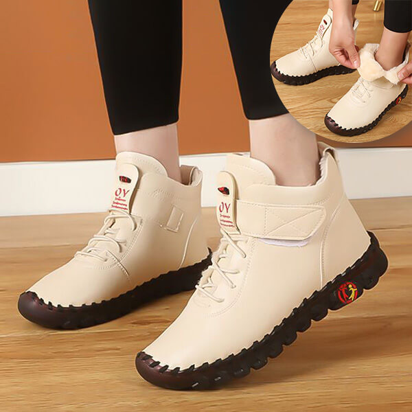 Stylish women's snow boots, high-top design, non-slip sole for icy conditions.