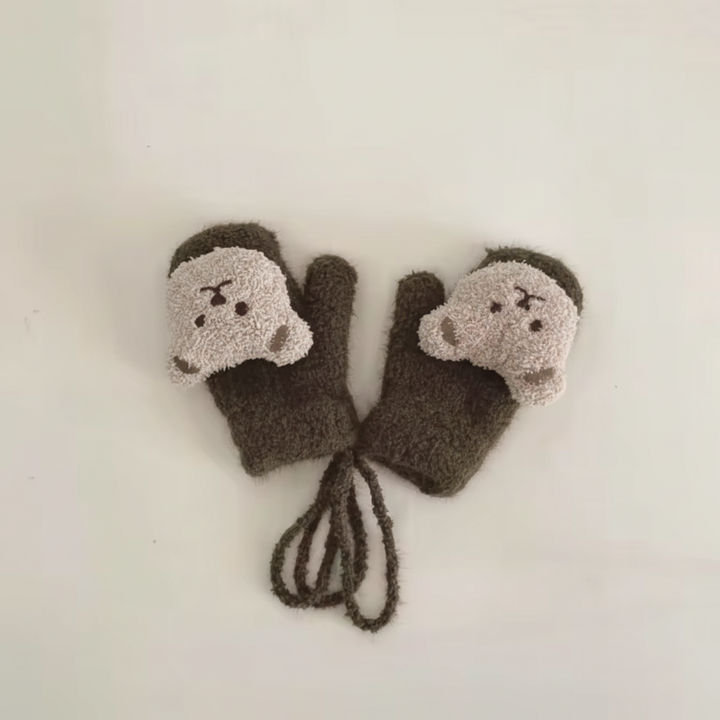Pair of colorful knitted baby mittens with a white connecting strap spread out.