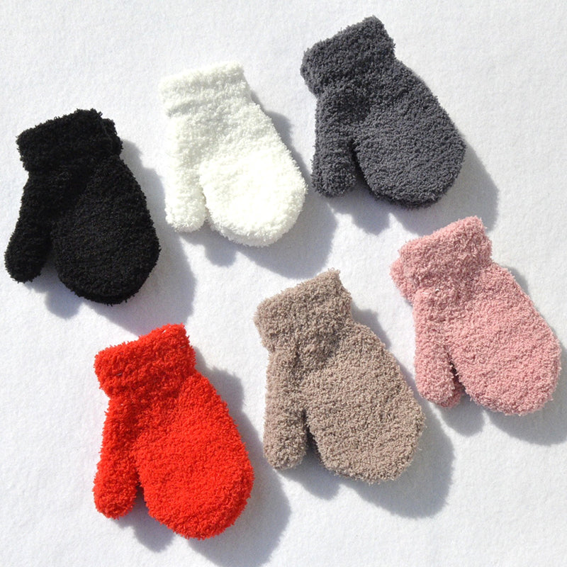 Warm pink children's winter mittens with thick plush fleece, perfect for toddlers in cold weather.