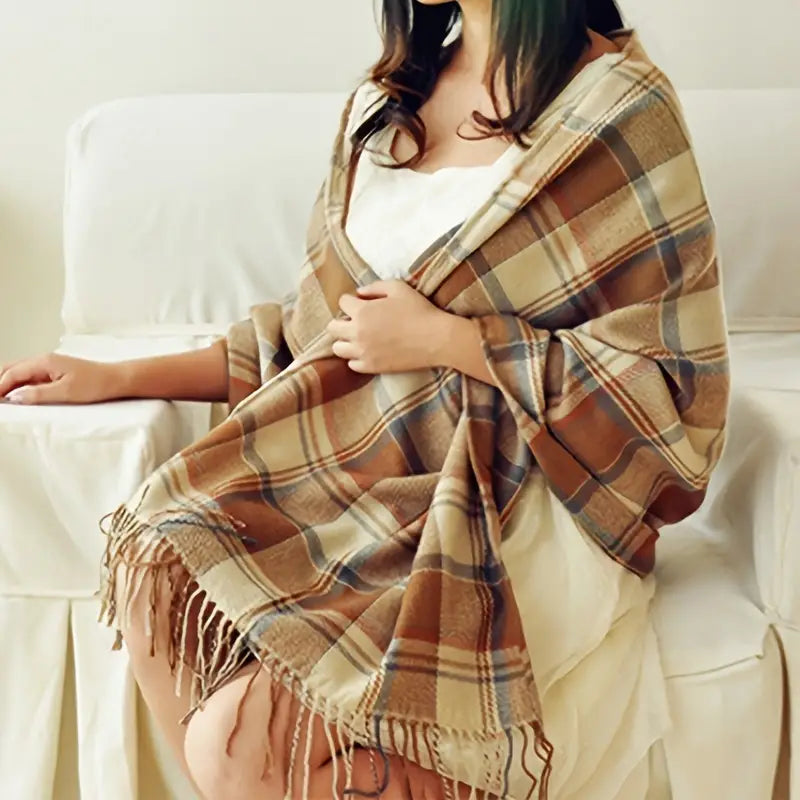 Warm women's luxury cashmere scarf with classic check pattern in winter colors, perfect fashion accessory.