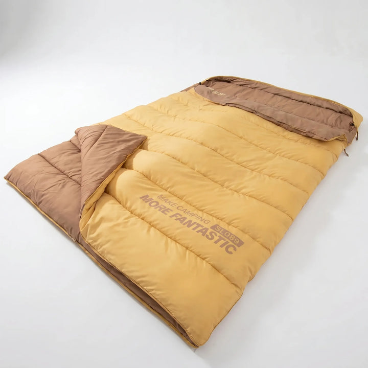 Insulated double sleeping bag in yellow & brown for couples camping. Warm & cozy for winter/summer outdoor adventures.