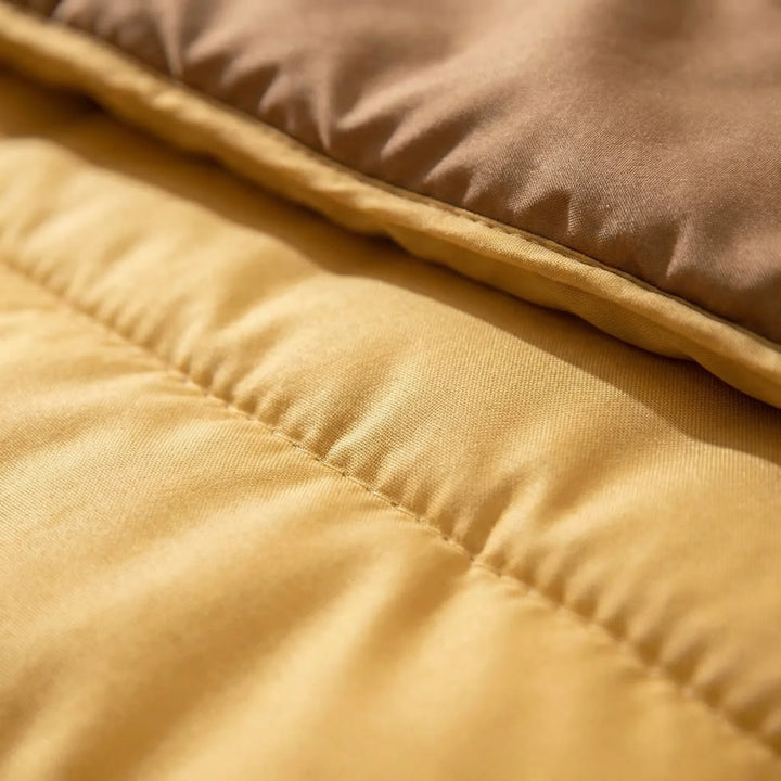 Portable yellow & brown double sleeping bag, perfect outdoor gear for couples camping, hiking, and travel. Warm & insulated.
