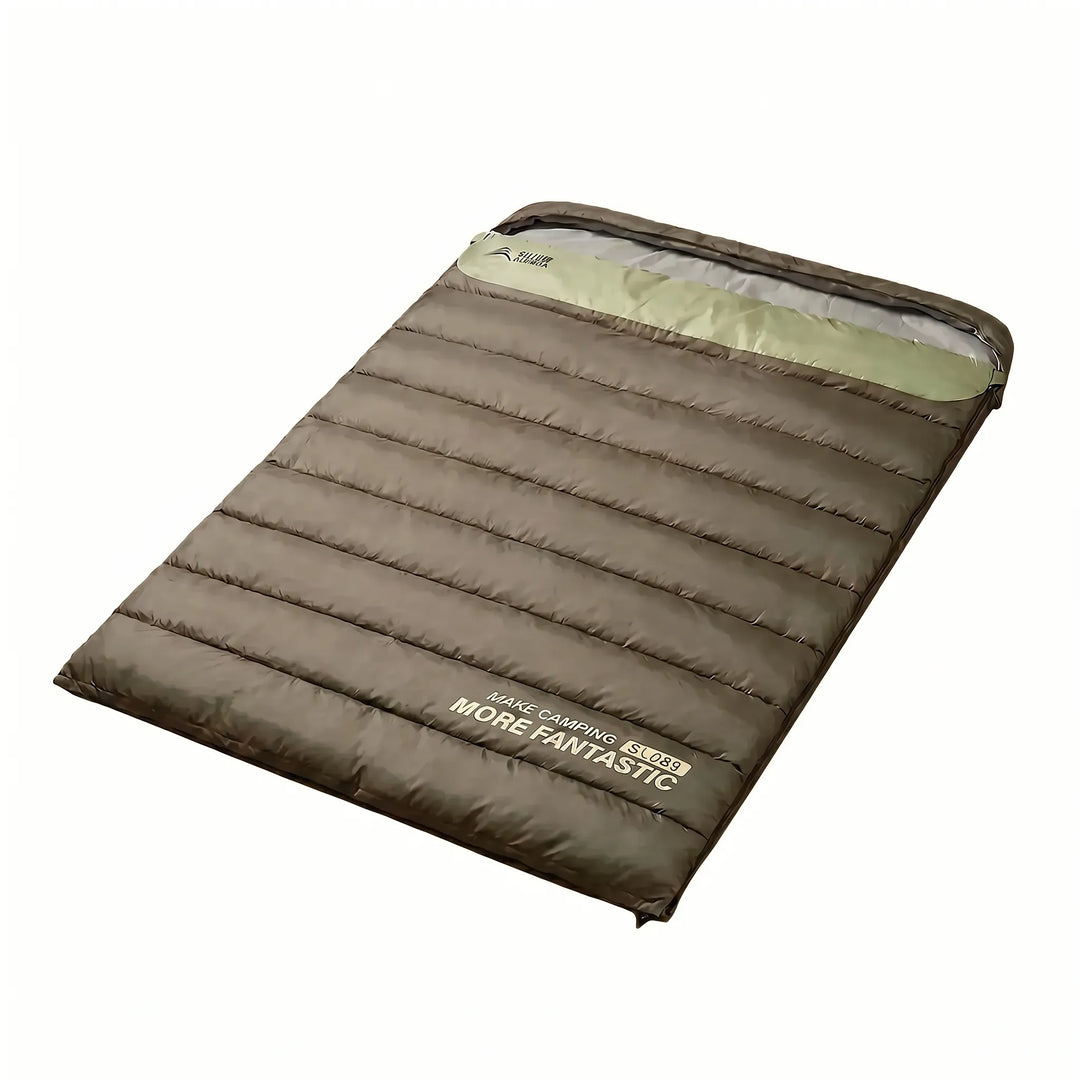 Couples enjoy warm camping with this yellow & brown double sleeping bag. Portable, insulated outdoor gear for any season.