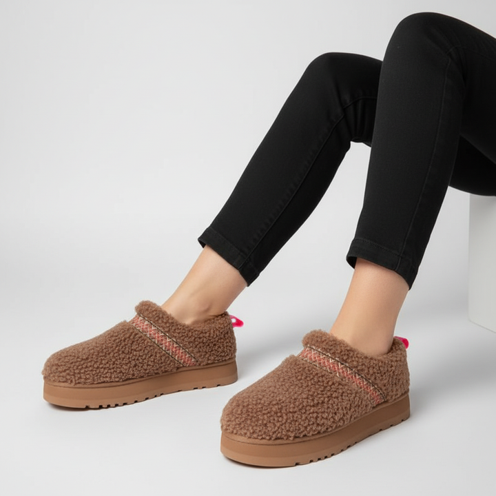 Soft pink women's padded house shoes with non-slip sole, ideal for winter essentials