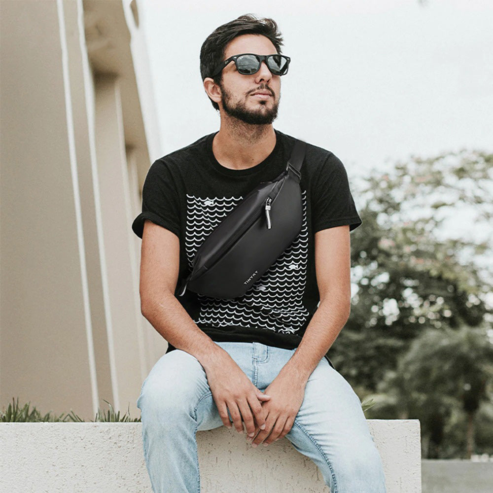Durable water-resistant waist bag with multiple pockets for secure outdoor essentials.