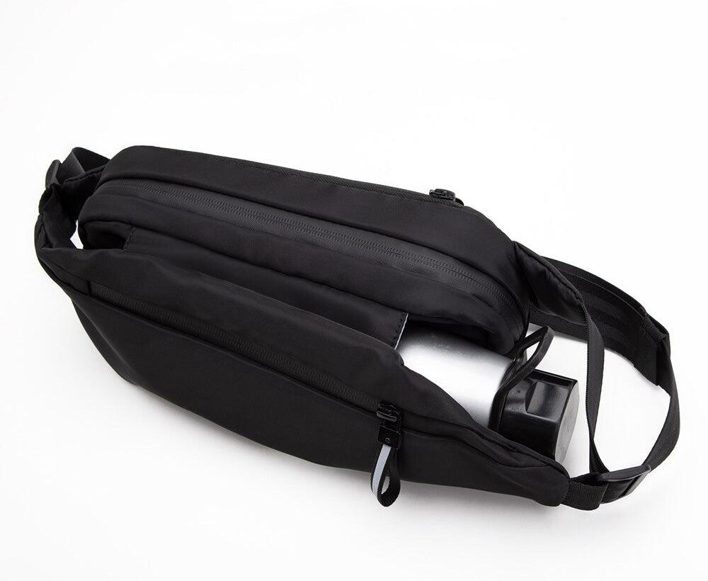 Secure multi-pocket fanny pack, water-resistant design for active travel & outdoor use.
