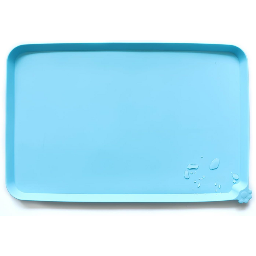 Waterproof pet feeding mat in blue, with spill-proof raised walls, ideal for messy eaters