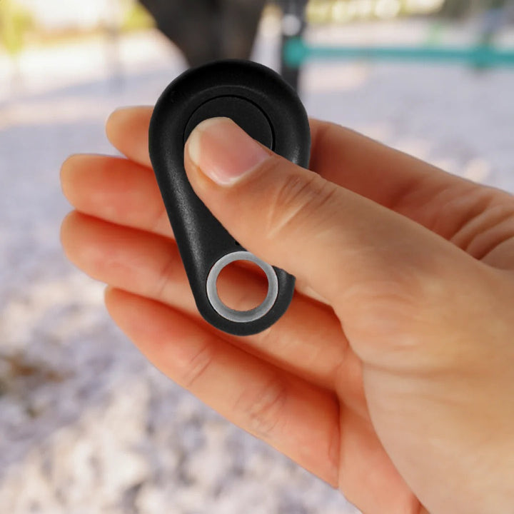 Sleek waterproof smart GPS tracker attached to a dog collar, ensuring pet safety & real-time location.