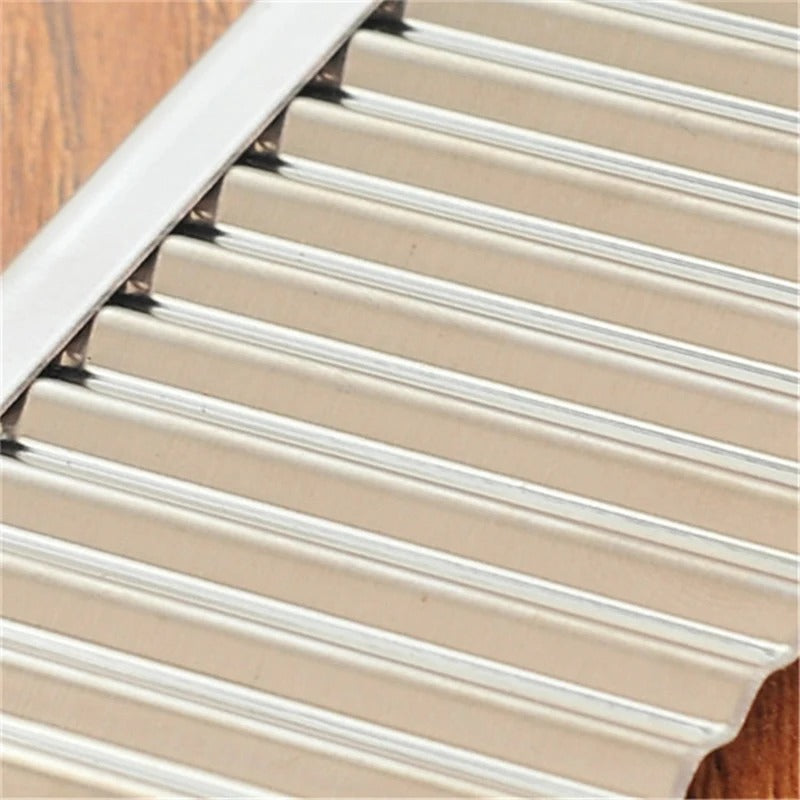 Durable stainless steel wavy vegetable knife for making homemade crinkle cut french fries and decorative chips.