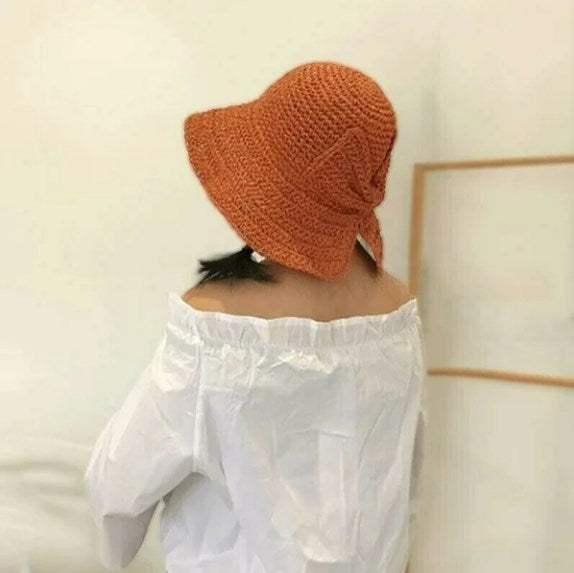 Solid color women's sun hat with a curved brim, a versatile fashion accessory for any summer outfit