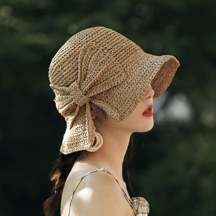 Stylish women's sun hat in solid color with curved brim, perfect for beach and summer, UV protection
