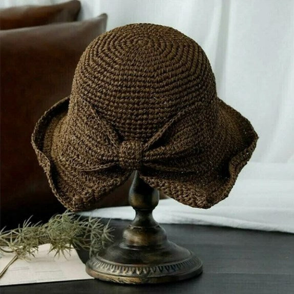 Fashionable women's sun hat with a wide curved brim, ideal for sun protection and summer style