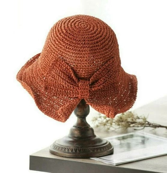 Adjustable women's sun hat with a curved brim, solid color, lightweight, perfect for travel