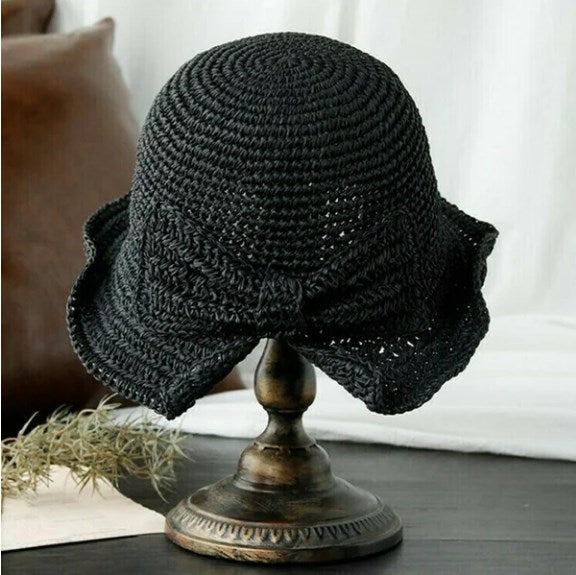 Lightweight women's sun hat with a gracefully curved brim, designed for comfort and sun protection