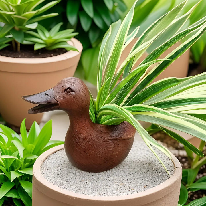 Charming duck flowerpot statue, ideal for garden decor, desktop plants, or as a unique gift idea.