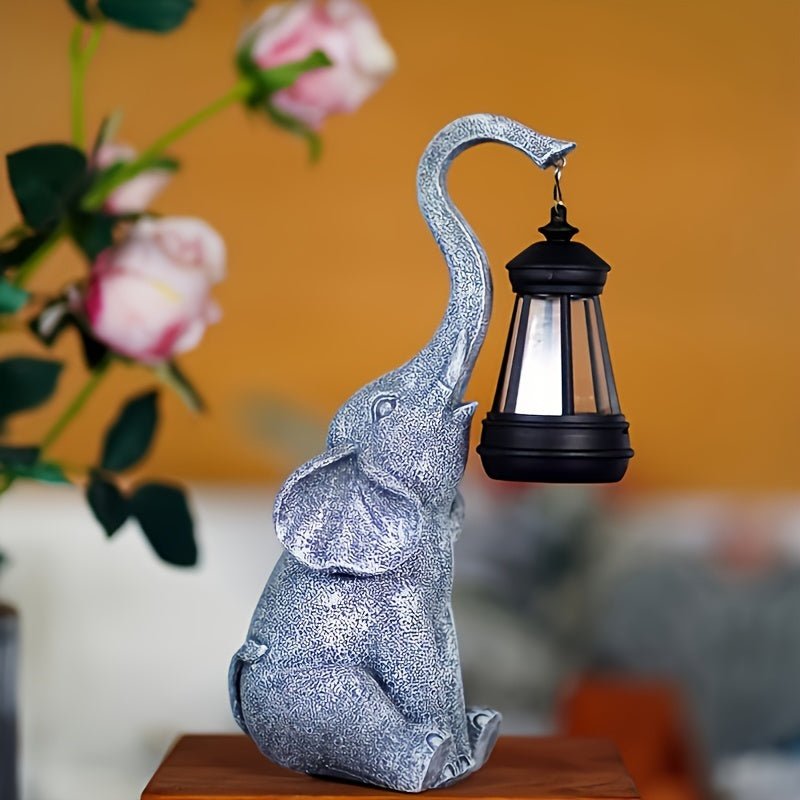 Solar-powered elephant garden lamp, a unique resin statue offering ambient lighting for whimsical patio decor.