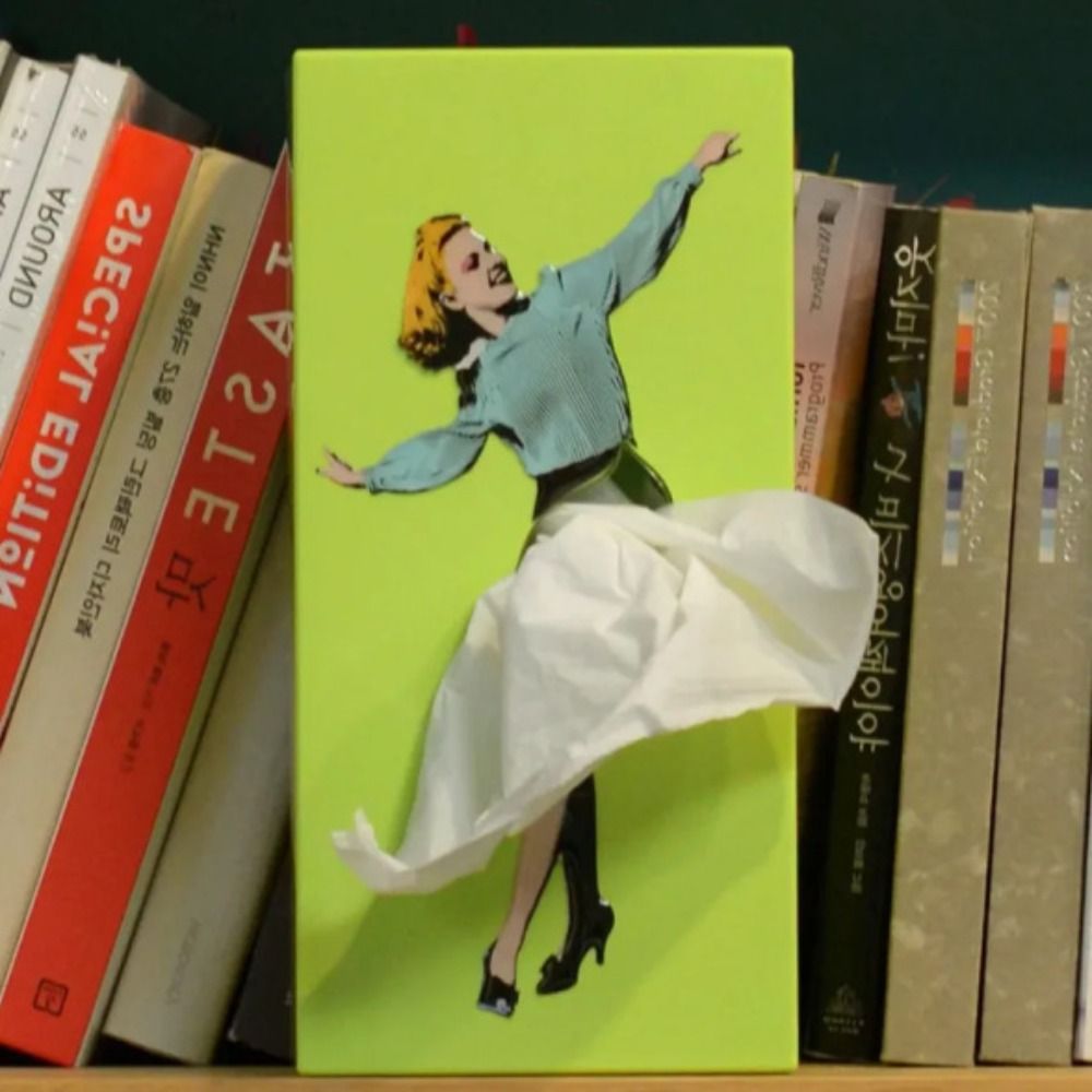 Novelty flying skirt tissue holder. Playful and unique design desktop organizer in vibrant colors.
