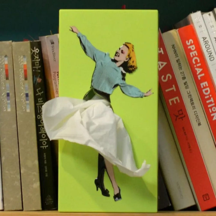 Novelty flying skirt tissue holder. Playful and unique design desktop organizer in vibrant colors.