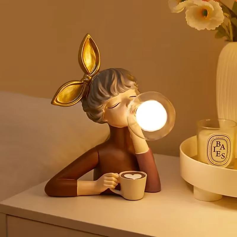 Whimsical girl figurine lamp, a charming resin art table lamp for enchanting home decor and ambient light.