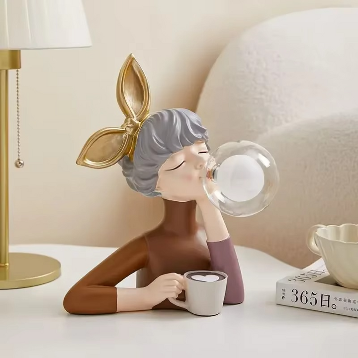 Decorative whimsical girl figurine lamp, an elegant home decor accent providing ambient light for any room.