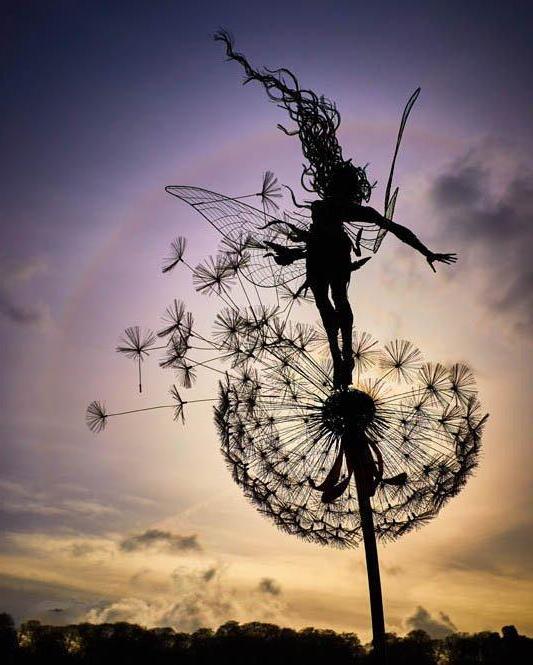 Metal art dancing fairy garden stake. Whimsical dandelion outdoor decor for a magical wonderland.