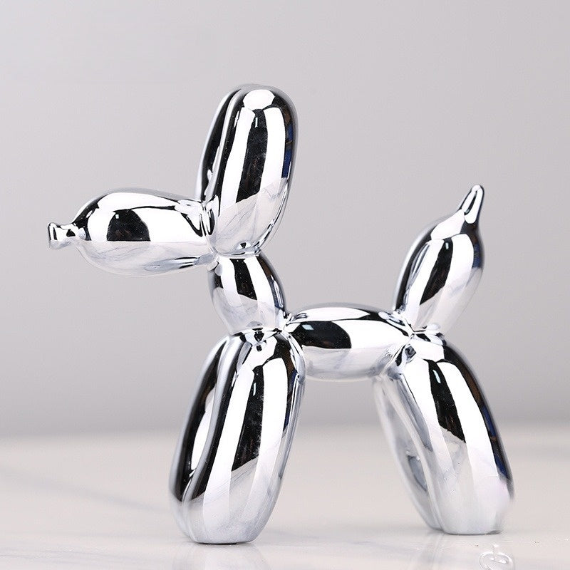 Whimsical metallic balloon dog sculpture. Modern resin figure, playful home decor or unique desktop art accent.