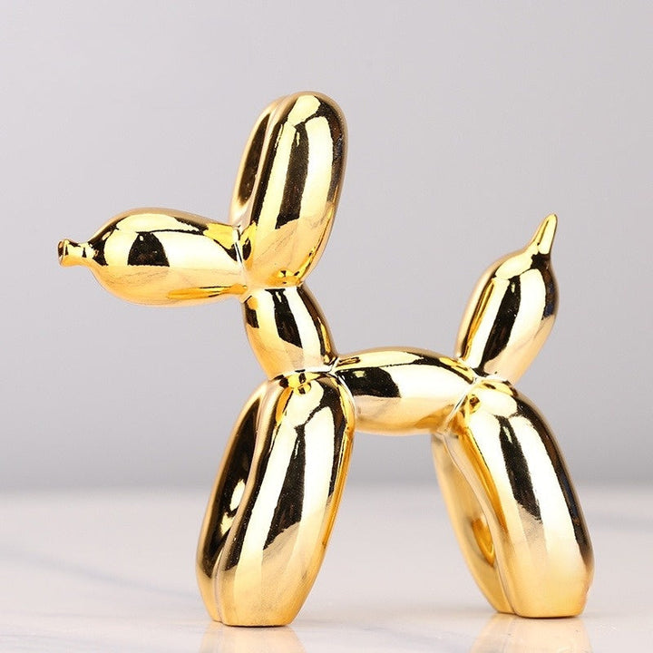Close-up: Sleek resin balloon dog sculpture with a metallic finish. Modern whimsical art piece for stylish home accents.