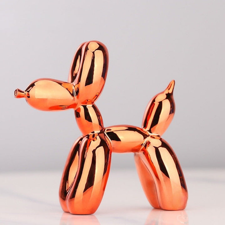Playful resin balloon dog sculpture. Ideal modern home decor accent for shelves, desks, or interior design.