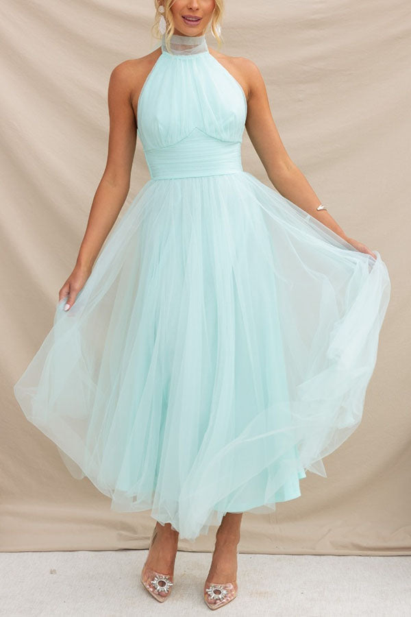 Stylish women's whimsical tulle midi dress. Elegant A-line formal or wedding guest dress for special events.