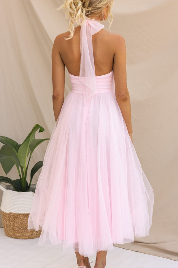 Whimsical tiered tulle midi dress, elegant & colorful. Ideal formal or wedding guest party attire for women.