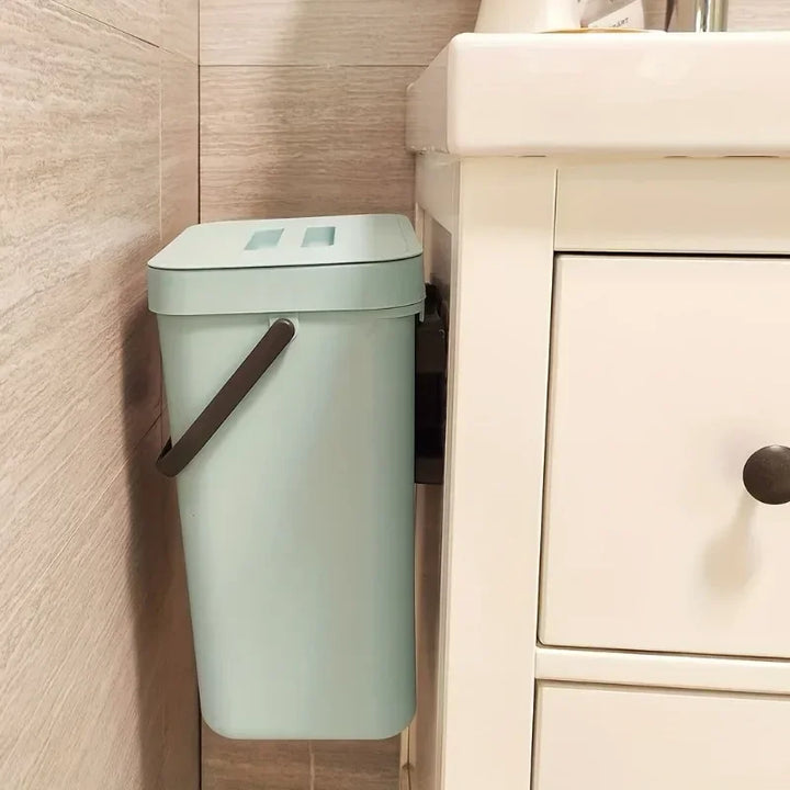 Silver 5L quiet-close sealed trash can for office or home, features odor control lid, compact and eco-friendly