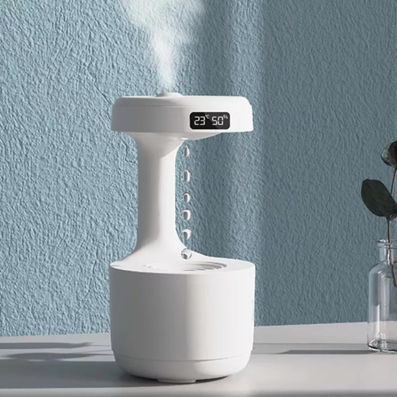White AquaGlow luxury anti-gravity humidifier diffuser. Modern home decor for air quality & relaxation.