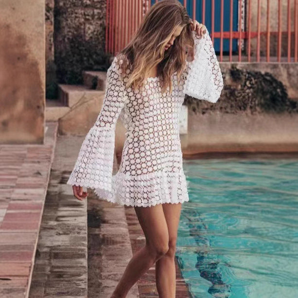 Elegant white backless mini dress for women, with unique flared sleeves, suitable as a summer vacation dress