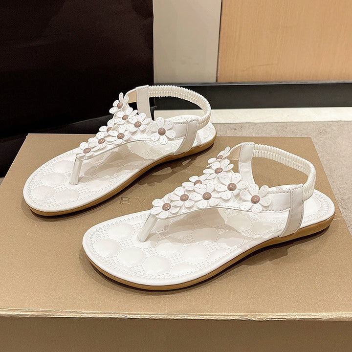 Stylish BloomGrace women's open-toe sandals featuring beautiful floral embellishments for summer footwear.