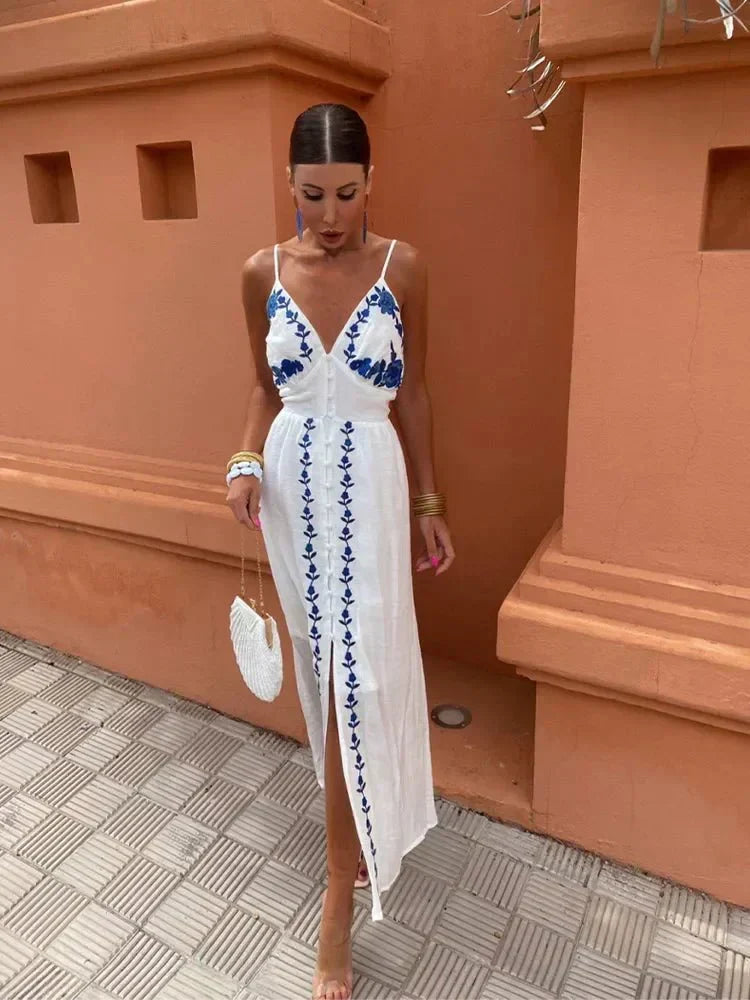 White boho embroidered maxi dress for wedding guests, summer events & vacations. Elegant V-neck, flowy design.