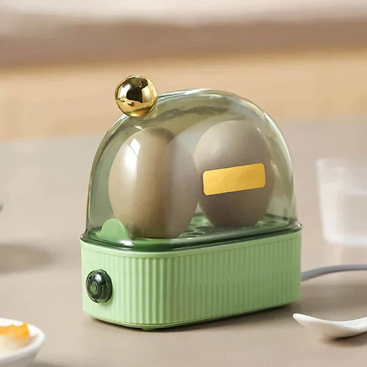 White compact electric egg cooker with automatic shutoff for perfect quick-cooked eggs.